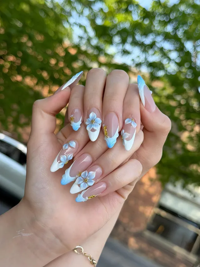 Blue and white almond nails with delicate art