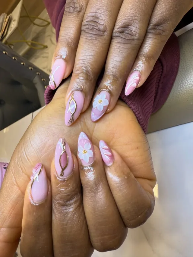 Pink marble nails with gold and floral detail