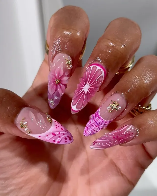 Pink ombré stiletto nails with charms
